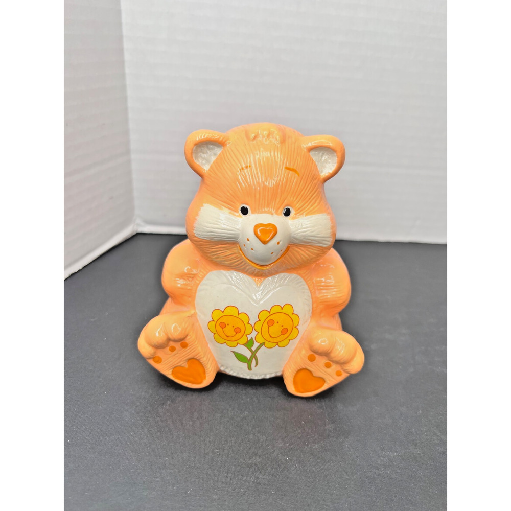 VINTAGE SUNSHINE CARE BEAR CERAMIC PIGGY BANK. ORANGE. USED.